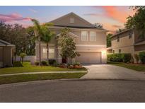 Charming two-story home with a well-manicured lawn and lovely landscaping at 12307 Duckett Ct, Spring Hill, FL 34610