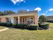 Charming single-story home with a well-manicured lawn and inviting front porch at 9332 Whitstone Ct, New Port Richey, FL 34655