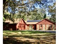 Charming single-story home with unique siding details and well-maintained landscaping at 1224 Candlelight Blvd, Brooksville, FL 34601