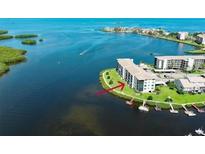 Waterfront condo community with boat docks on a sunny day. Lovely coastal living! at 8150 Brent St # 713, Port Richey, FL 34668