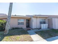 Charming single story home with quaint front yard and walkway to front door at 3850 Staysail Ln, Holiday, FL 34691