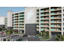 Stunning exterior view of Aqua Harbor condos featuring modern architecture, parking, and lush landscaping at 5015 Us Highway 19 # 307, New Port Richey, FL 34652