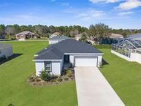 Charming one-story home with well-manicured lawn and two car garage at 8338 Maybelle Dr, Weeki Wachee, FL 34613
