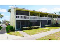 Charming two-story condo with screened-in porch, balcony, and well-maintained landscaping at 20857 Haulover Cv # B15, Lutz, FL 33558
