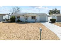 Charming single-story home featuring a well-maintained exterior and a spacious front yard at 4024 Dalwood Dr, Holiday, FL 34691