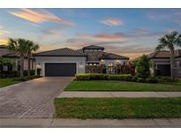 Beautiful home featuring manicured landscaping, stone accents and a two-car garage at 3130 Forsythia Dr, Odessa, FL 33556