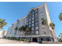 Multi-story condominium with palm trees, secure parking, and a modern architectural design at 700 S Harbour Island Blvd # 807, Tampa, FL 33602