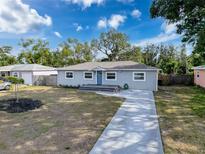 Charming single-story home with a well-manicured lawn, long driveway and inviting entrance at 4540 52 N Ave, St Petersburg, FL 33714