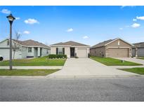 Charming single-story home with well-manicured lawn and inviting curb appeal in a residential neighborhood at 6644 Longboat Dr, Brooksville, FL 34604