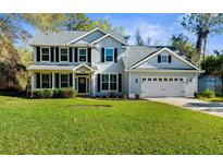 Charming two-story home with a well-manicured lawn and attached two-car garage in a lovely neighborhood at 11227 Lakeview Dr, New Port Richey, FL 34654