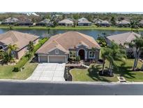 An aerial view of this single Gathering home featuring a private water view at 2330 Tarragon Ln, New Port Richey, FL 34655