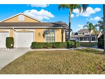 Inviting single-story home with manicured landscaping and attached one car garage at 4208 Boston Cir, New Port Richey, FL 34653