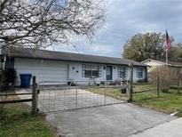 Charming single-story home with a fenced front yard and attached garage at 6361 Boxwood St, Brooksville, FL 34602