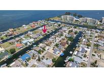 Stunning aerial view of waterfront neighborhood with canal access and boats docked at private residences at 13610 Claudia Dr, Hudson, FL 34667