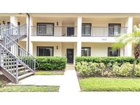 Inviting two-story condo with well-manicured landscaping and private entrance at 3590 Magnolia Ridge Cir # 1103-C, Palm Harbor, FL 34684