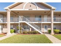 Inviting condo building with well-maintained landscaping and charming architectural details at 4933 Myrtle Oak Dr # 23, New Port Richey, FL 34653