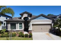 Charming one-story home with a two-car garage, and landscaped yard at 12403 Coralbean Ct, New Port Richey, FL 34654