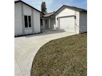Charming single Gathering house with driveway and two car garage at 7336 Ivory Ter, New Port Richey, FL 34655