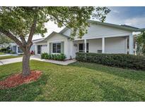 Charming single-story home with well-maintained lawn, inviting curb appeal, and an attached garage at 9336 Cape Charles Ave, New Port Richey, FL 34655