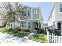 Charming two-story home featuring a well-manicured lawn, beautiful landscaping, and a welcoming front entrance at 3465 Bumelia Ln, New Port Richey, FL 34655