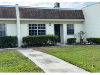 Charming single-story home with well-maintained lawn and updated windows at 11310 Carriage Hill Dr # 4, Port Richey, FL 34668