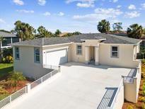 Beautful single story home with two-car garage, well-manicured landscaping, and modern architectural design at 4237 Marine Pkwy, New Port Richey, FL 34652