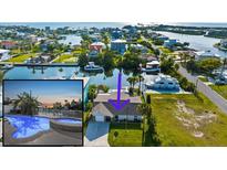 Waterfront home with boat dock and lift offers scenic views, lush landscaping, and easy access to the open water at 4503 Jacona Dr, Hernando Beach, FL 34607