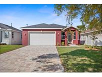 Charming single-story home featuring a brick driveway and a two-car garage at 8312 40Th N St, Pinellas Park, FL 33781