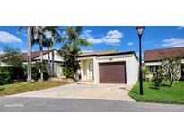 Charming single story home with a well maintained front yard and a one car garage at 4548 Somerset Pl, New Port Richey, FL 34652