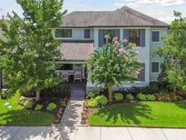 Attractive two-story home with a well-manicured lawn and mature landscaping, providing curb appeal at 12272 Rangeland Blvd, Odessa, FL 33556