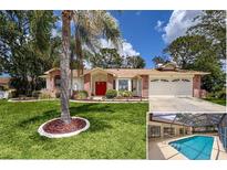 Charming one-story home boasting a bright red front door, mature landscaping, and a two-car garage at 1280 Thornton Ct, Spring Hill, FL 34608