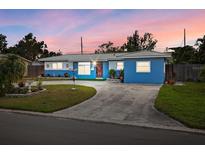 Charming single-story home with a well-maintained lawn, a welcoming atmosphere, and tasteful blue exterior paint at 7230 17Th N Ln, St Petersburg, FL 33702