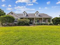 Charming single-story home with a well-manicured front lawn and inviting curb appeal at 10318 Piper Dr, New Port Richey, FL 34654