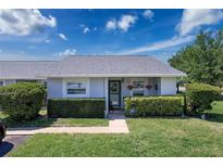 Charming single-story home with well-manicured lawn, lush landscaping, and welcoming front entrance at 12545 Dearborn Dr # D, Bayonet Point, FL 34667