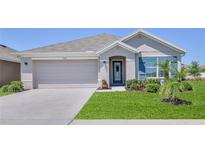 Charming single-story home with a two-car garage and well-manicured lawn at 13160 Golden Lime Ave, Spring Hill, FL 34609