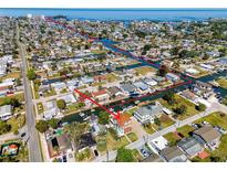 Beautiful waterfront property featuring access to channels and ocean, surrounded by tropical landscaping and charming neighborhood at 13741 Judy Ave, Hudson, FL 34667