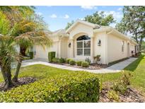 Charming single-story home featuring well-maintained landscaping and a two-car garage at 4407 Caliquen Dr, Brooksville, FL 34604
