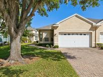 Charming single-story home with a well-maintained lawn and a two-car garage at 7427 Wimpole Dr # 7427, New Port Richey, FL 34655