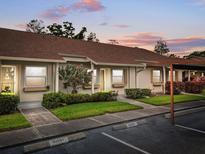 Charming one-story home featuring a well-maintained lawn and guest parking at 10780 43Rd N St # 702, Clearwater, FL 33762