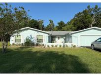 Charming single-story home featuring a well-manicured lawn and attached garage at 11648 Boynton Ln # 39Gb, New Port Richey, FL 34654