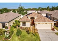 Lovely single-story home with a well-manicured lawn and mature landscaping at 4321 High Ridge Ave, Spring Hill, FL 34609