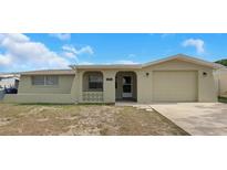 Charming single-story home with a well-maintained front yard and attached one car garage at 6206 11Th Ave, New Port Richey, FL 34653