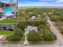 Expansive aerial view of the beautiful property, showcasing the home, lot size and surrounding landscape at 18620 Gracie Lee St, Spring Hill, FL 34610
