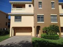 Charming two-story home with a spacious two car garage and well maintained landscaping at 1514 Citrine Trl, Tarpon Springs, FL 34689