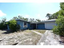 Charming single-story home with a front yard and attached garage at 6327 Skyline Ct, Spring Hill, FL 34606