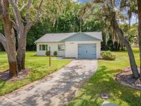 Charming single-story home with a well-manicured lawn and a cozy, inviting curb appeal at 11512 Yellow Birch Ct, New Port Richey, FL 34654