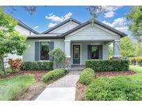 Charming single-story home with tidy landscaping, stone accents and a covered front porch at 3056 Abrams Trl, Odessa, FL 33556