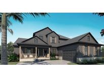 Two-story home featuring a covered porch, attached garage, complementary landscaping, and architectural design at 5477 Creek Ridge Rd, Brooksville, FL 34601