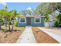 Charming home featuring a well-maintained lawn, a quaint walkway, and inviting curb appeal at 1000 Magnolia Dr, Clearwater, FL 33756
