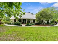 Charming single story home with manicured landscaping and a metal roof at 1253 Culbreath Rd, Brooksville, FL 34602